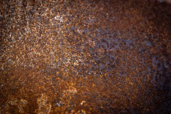 Texture macro d'un métal patiné par la rouille