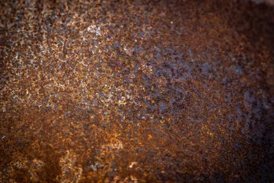Texture macro d'un métal patiné par la rouille